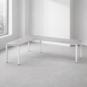 Mesa de oficina moderna y minimalista en espacio luminoso y despejado.