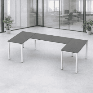 Mesa de oficina en forma de L, ideal para espacios de trabajo modernos y colaborativos.